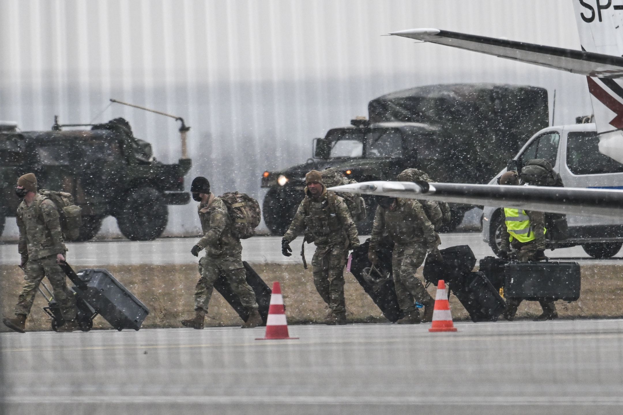 RZESZOW, POLAND - FEBRUARY 06: US Army Soldiers exit a U.S. Air Force Boeing C-17A Globemaster III transport aircraft at Jasionka Rzeszow Airport on February 06, 2022 in Rzeszow, Poland. Tensions between the NATO military alliance and Russia are intensifying due to Russia's move of tens of thousands of troops as well as heavy weapons to the Ukrainian border, causing international fears of a possible Russian invasion of Ukraine. (Photo by Omar Marques/Getty Images)