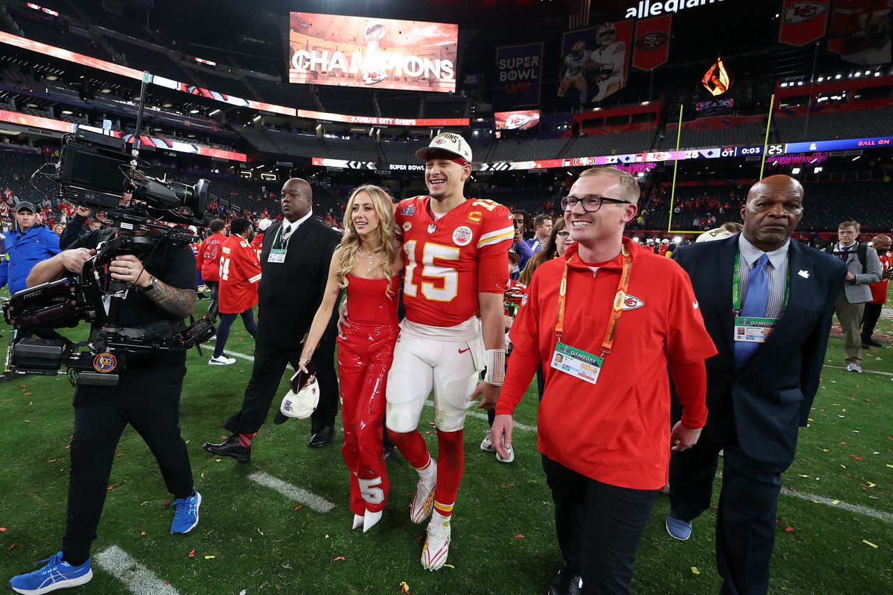 LAS VEGAS, NEVADA - FEBRUARY 11: Patrick Mahomes #15 of the Kansas City Chiefs and his wife, Brittany Mahomes, walk on the field after defeating the San Francisco 49ers 25-22 in overtime during Super Bowl LVIII at Allegiant Stadium on February 11, 2024 in Las Vegas, Nevada. (Photo by Ezra Shaw/Getty Images)