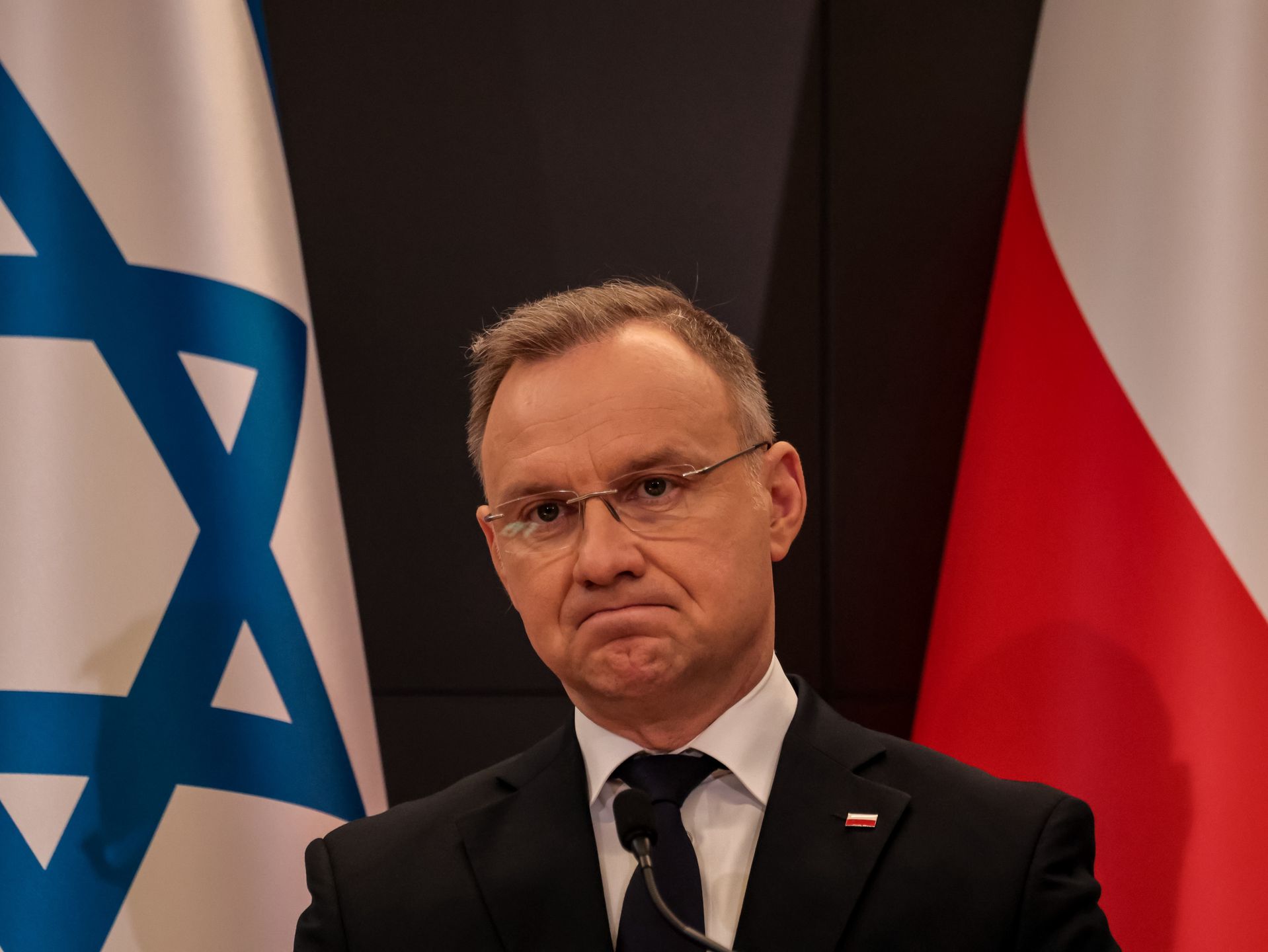 OSWIECIM, POLAND - 2025/04/24: Andrzej Duda, president of the Republic of Poland speaks during the joint press statement with the president of Israel, Isaac Hertzok at the Auschwitz Museum - former Nazi German Concentration Camp during the International March of the Living (MOTL). MOTL takes place on Holocaust Remembrance Day, it gathers Holocaust survivors, families and supporters. They walk three kilometers between the Auschwitz camp and Birkenau the extermination centre in memory of the holocaust victims of World War II. (Photo by Dominika Zarzycka/SOPA Images/LightRocket via Getty Images)