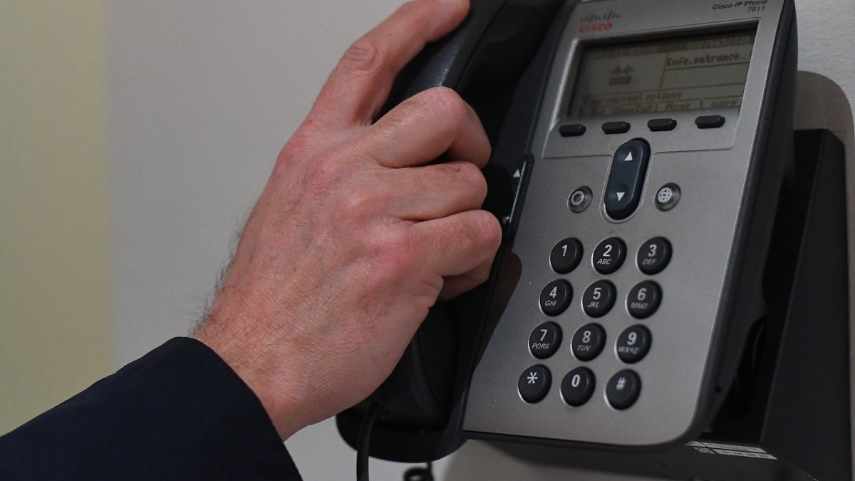 A picture posed by a model of a man using a telephone with a bare hand in London. England's deputy chief medical officer Dr Jenny Harries has said that "many thousands of people" would contract coronavirus as the disease continued to spread in the UK. PA Photo. Picture date: Wednesday March 11, 2020. See PA story HEALTH Coronavirus. Photo credit should read: Victoria Jones/PA Wire (Photo by Victoria Jones/PA Images via Getty Images)