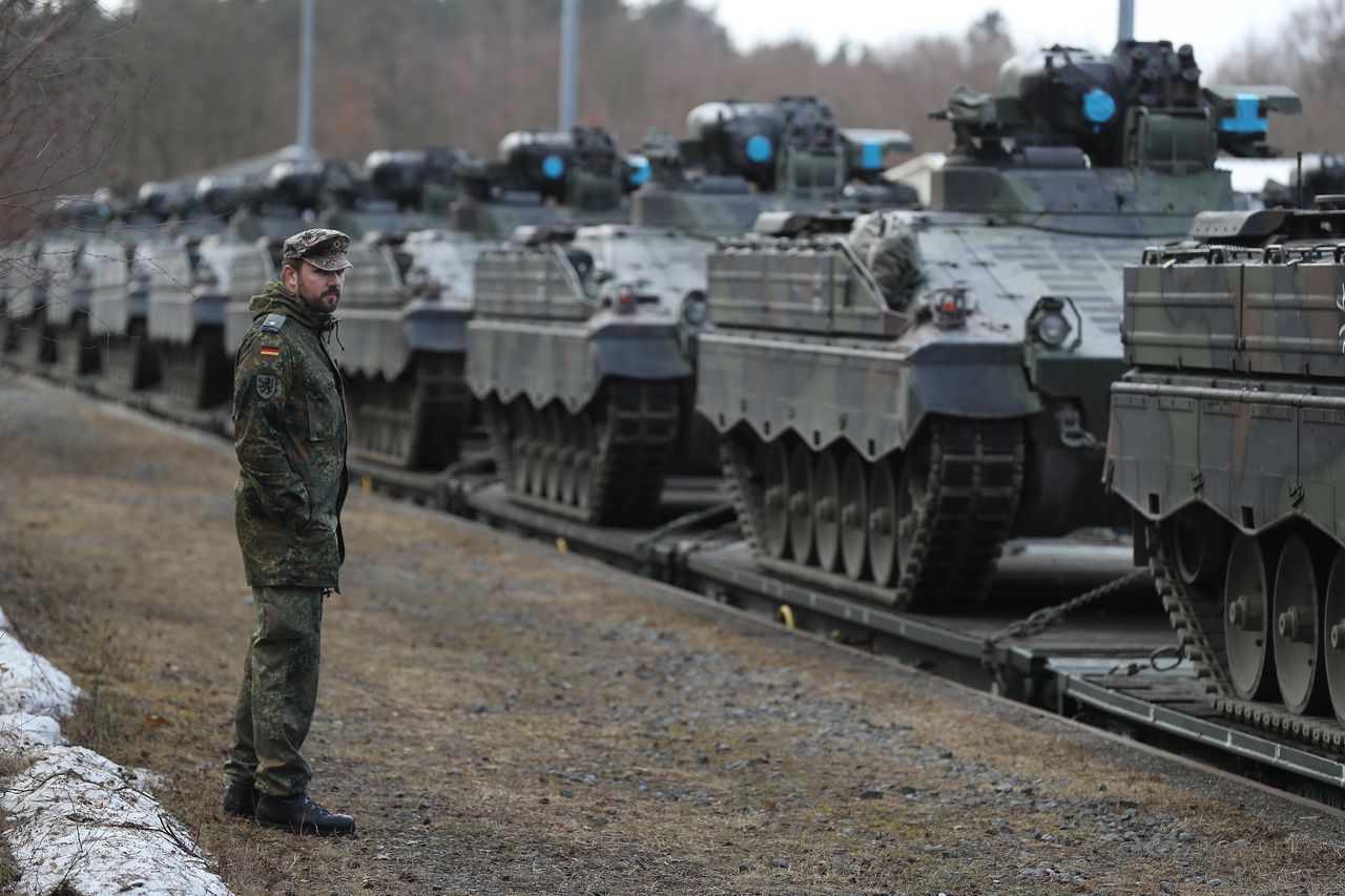 Military vehicles on railway platforms