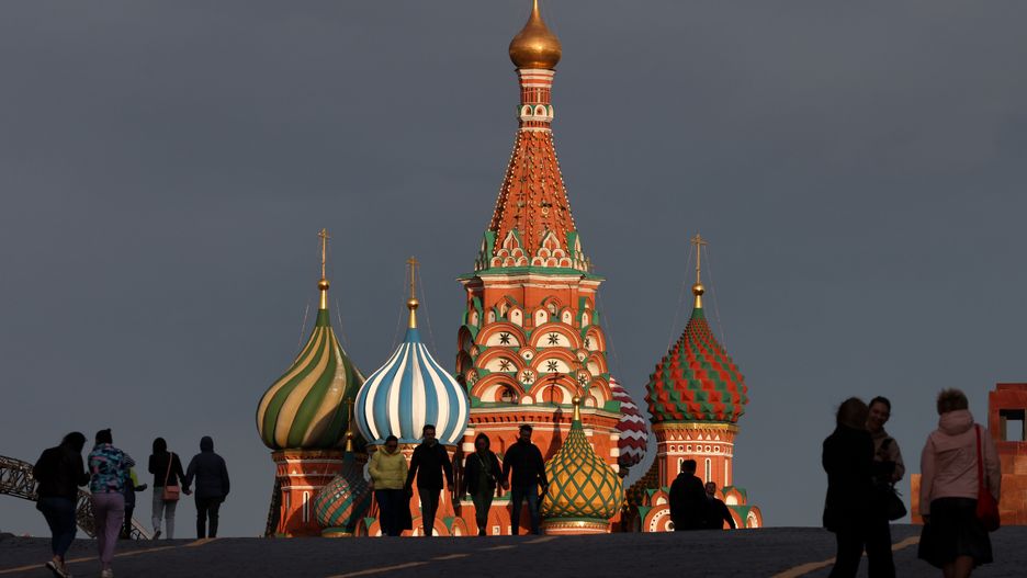 MOSCOW, RUSSIA - MAY 16, 2022: People walk in Red Square with St Basil's Cathedral seen in the background. Valery Sharifulin/TASS
