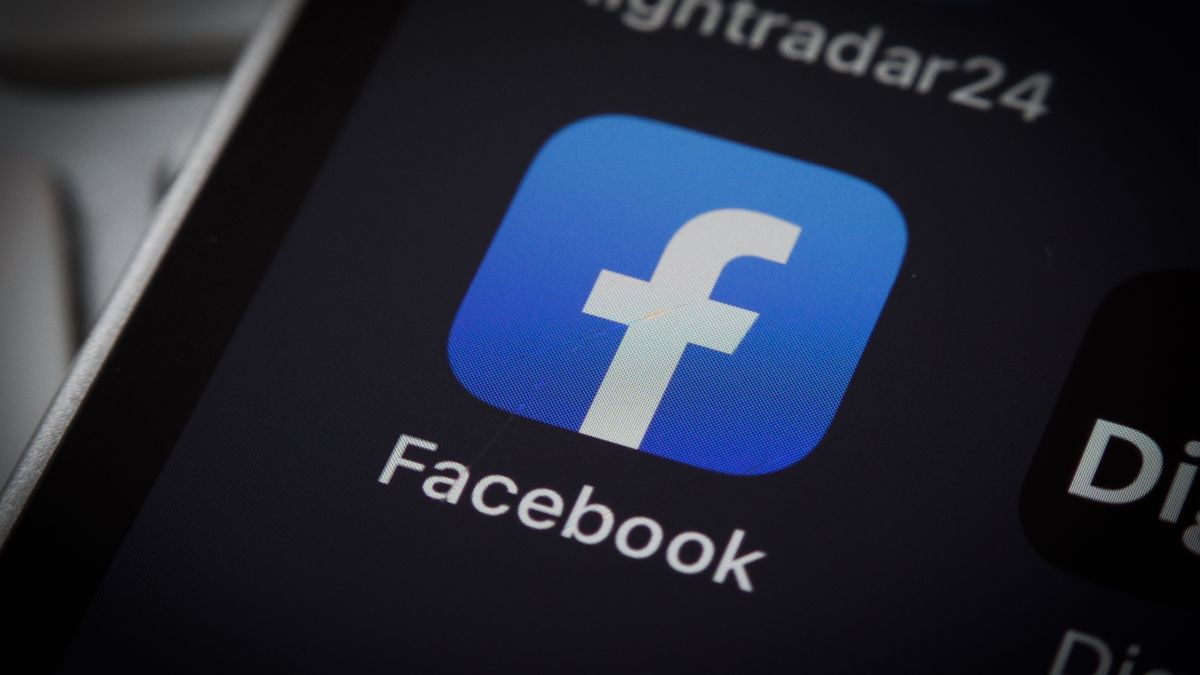 The Facebook logo is seen on an iPhone mobile device in this illustration photo in Warsaw, Poland on 12 October, 2022. (Photo by STR/NurPhoto via Getty Images)