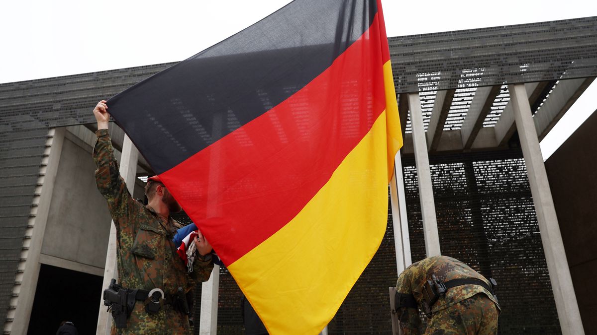 BERLIN, GERMANY - NOVEMBER 10: Soldiers of the German armed forces, the Bundeswehr, hoist a German flag in front of the Bundeswehr memorial prior to a wreath-laying ceremony at the main memorial of the Bundeswehr, Germany's armed forces, for Bundeswehr soldiers killed in foreign deployments on November 10, 2025 in Berlin, Germany. The German Defense Ministry and the German President are honouring six surviving U.S. World War II veterans today. The visit of the vets has been organized by a U.S. charity called Best Defense Foundation. (Photo by Maryam Majd/Getty Images)