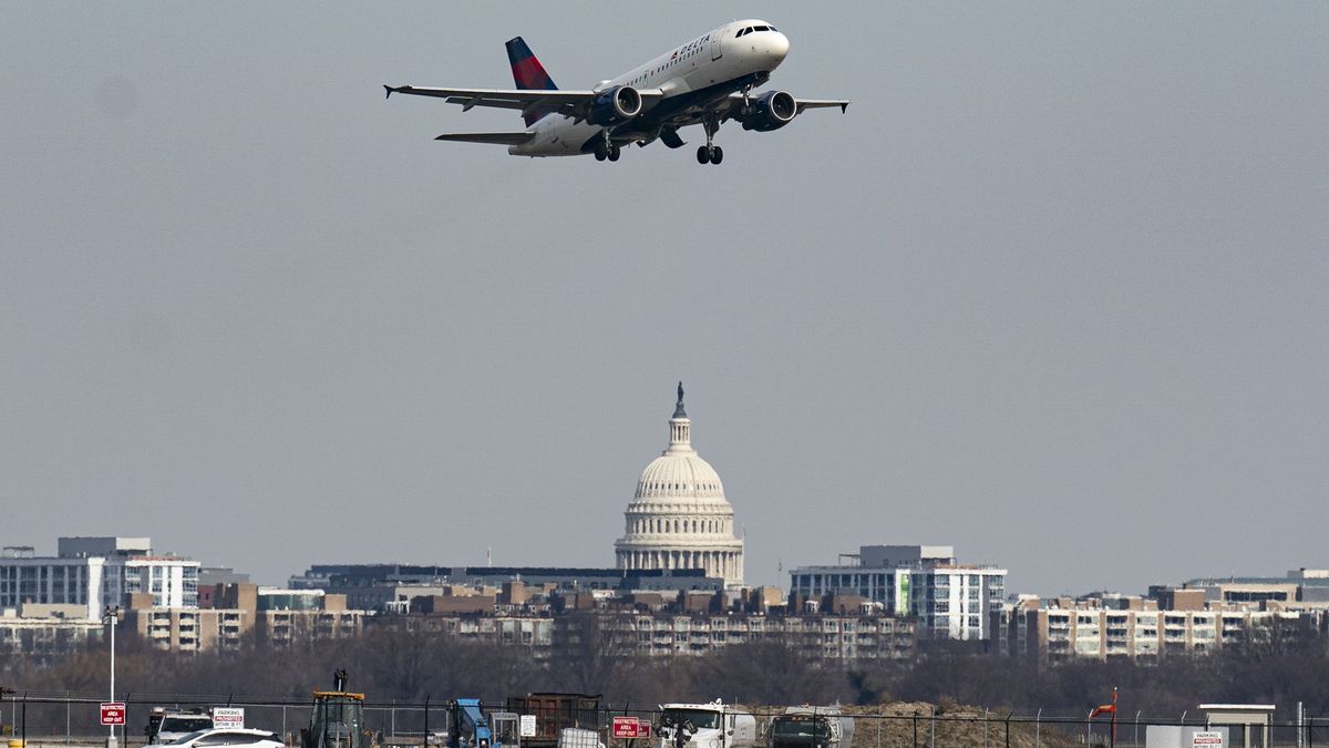 ARLINGTON, VIRGINIA - JANUARY 30: A plane takes off from Reagan National Airport after the crash last night of an American Airlines plane on the Potomac River as it approached the airport on January 30, 2025 in Arlington, Virginia. The American Airlines flight from Wichita, Kansas collided midair with a military Black Hawk helicopter while on approach to Ronald Reagan Washington National Airport. According to reports, there were no survivors among the 67 people on both aircraft. (Photo by Al Drago/Getty Images)