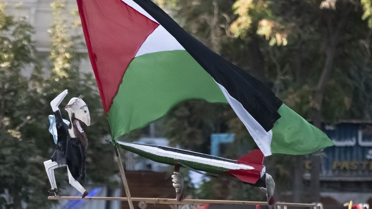 An Iranian protester (Not pictured) carrying an effigy of Israel and a Palestinian missile, during an anti-Israel protest in downtown Tehran on August 9, 2022. Iran's Revolutionary Guard Corps vice commander, General Ali Fadavi, said, As Iran's Supreme Leader stated and martyr General Qasem Soleimani has supported Palestinians, this support will continue and the Guard Corps will assist them.  (Photo by Morteza Nikoubazl/NurPhoto via Getty Images)