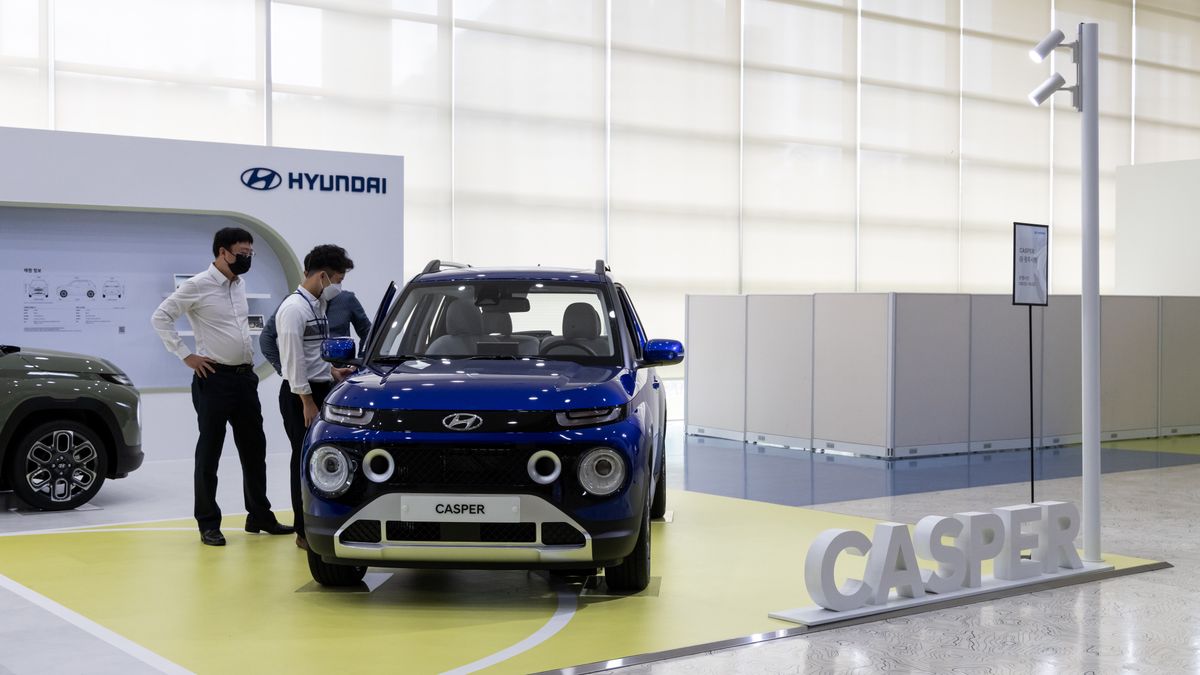 Visitors look at a Hyundai Motor Co. Casper mini sport utility vehicle (SUV) at Gwangju City Hall in Gwangju, South Korea, on Wednesday, Oct. 13, 2021. Gwangju Global Motors started production of Casper from September and aims to produce about 70,000 vehicles annually, according to the company. Photographer: SeongJoon Cho/Bloomberg via Getty Images