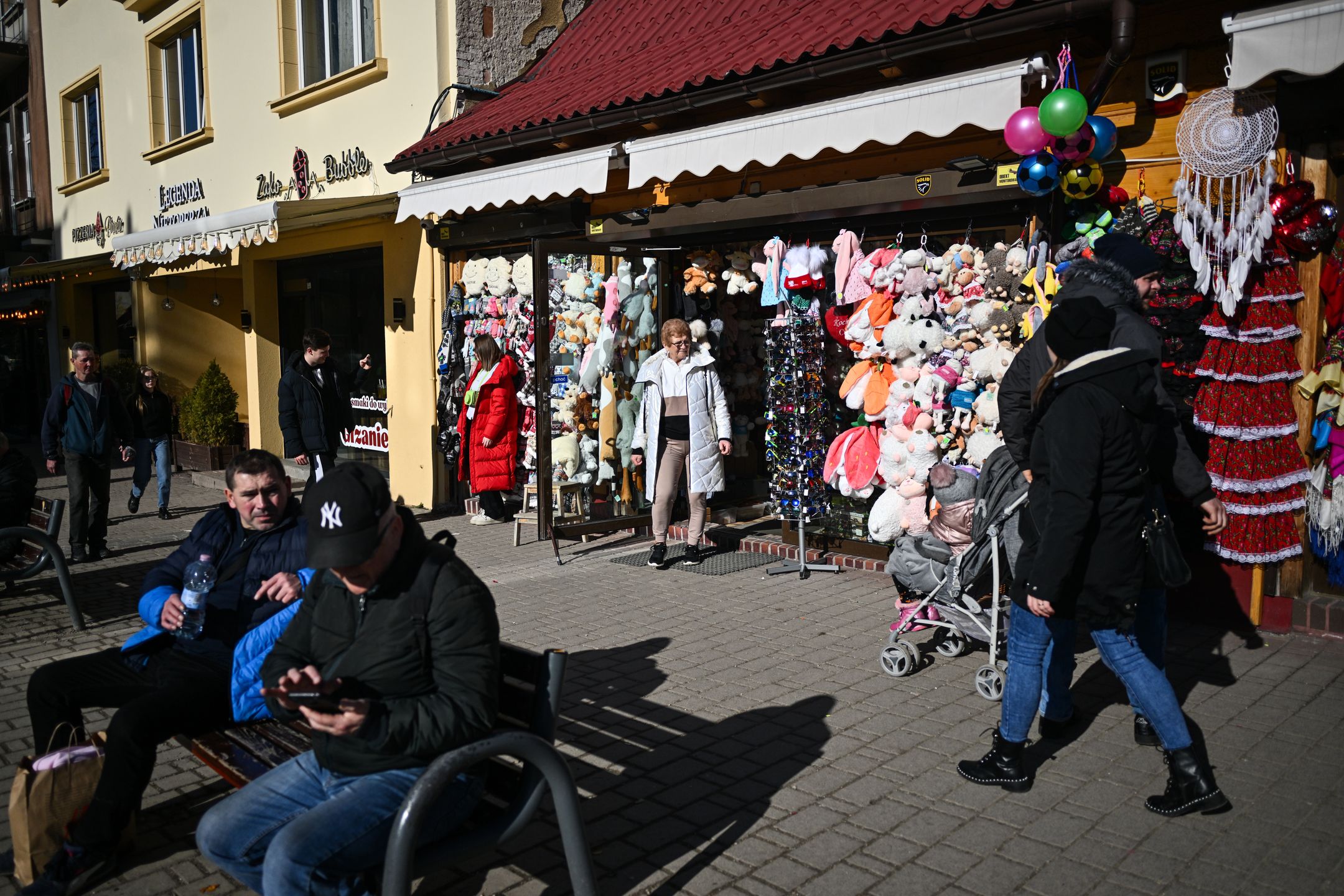 ZAKOPANE, POLAND - FEBRUARY 16: People enjoy the sun outdoors during an unusually high-temperature day in Zakopane, Poland on February 16, 2024. Poland is now having unusually warm temperatures, during a time, when Zakopane is full of snow and negative temperatures. All snow has melted during the past few days and one of the main attractions, the snow maze is melting and a reduced price has been introduced by the organizers. According to the European Union's Copernicus Climate Change Service, the period between February 2023 and January 2024 is the hottest 12-month period ever measured. During this time, global average temperatures rose 1.52 degrees Celsius. The 1.5 Celcius degrees boundary stands out because it was a limit established as part of the 2015 Paris climate agreement. (Photo by Omar Marques/Anadolu via Getty Images)