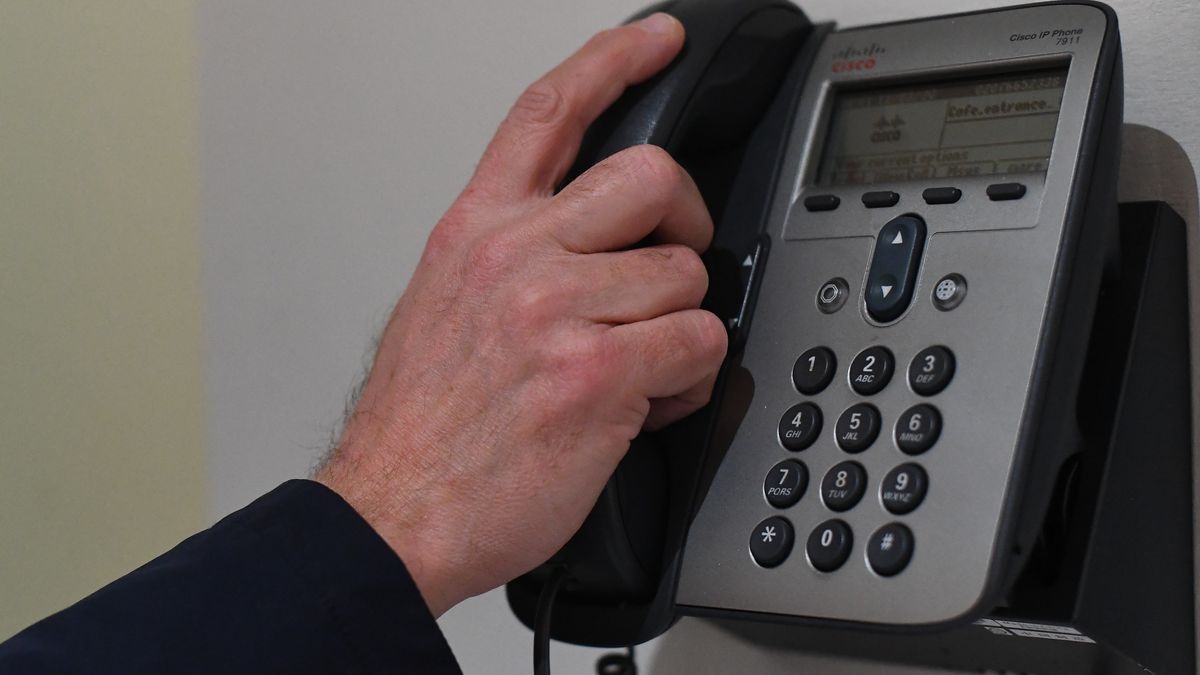 A picture posed by a model of a man using a telephone with a bare hand in London. England's deputy chief medical officer Dr Jenny Harries has said that "many thousands of people" would contract coronavirus as the disease continued to spread in the UK. PA Photo. Picture date: Wednesday March 11, 2020. See PA story HEALTH Coronavirus. Photo credit should read: Victoria Jones/PA Wire (Photo by Victoria Jones/PA Images via Getty Images)