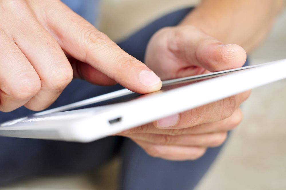 young man using a tablet computer