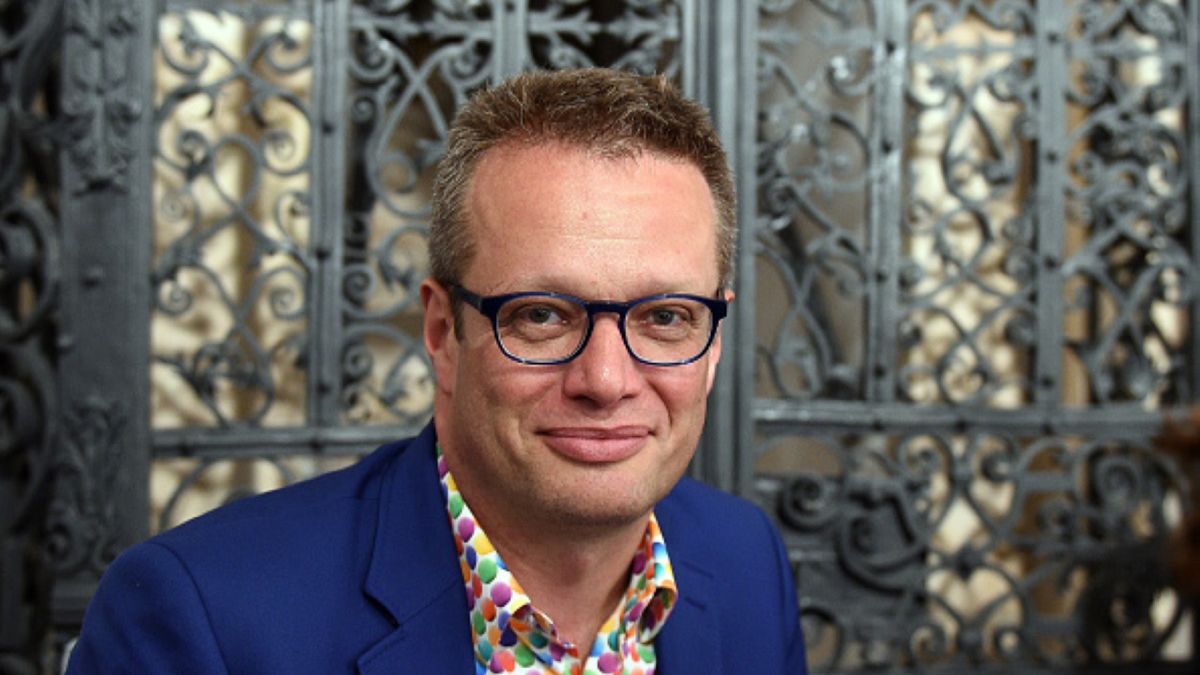 Marcin Meller próbował zabrać głos, jednak ktoś uparcie nie pozwalał mu tego zrobić 