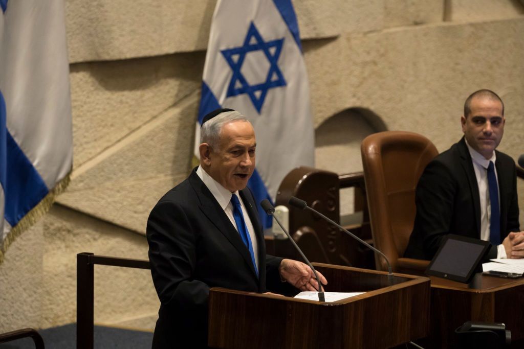Israel's New Government Is Sworn In To The Knesset
JERUSALEM, ISRAEL - DECEMBER 29:  Former and designated Israeli Prime Minister Benjamin Netanyahu speaks at the Israeli parliament during a new government sworn in discussion at the Israeli parliament on December 29, 2022 in Jerusalem, Israel. Conservative Benjamin Netanyahu and a bloc of nationalist and religious parties won a clear election victory last month and will be sworn in as government to the Knesset today. This completes Netenyahu's political comeback with a record sixth term in office.  (Photo by Amir Levy/Getty Images)
Amir Levy