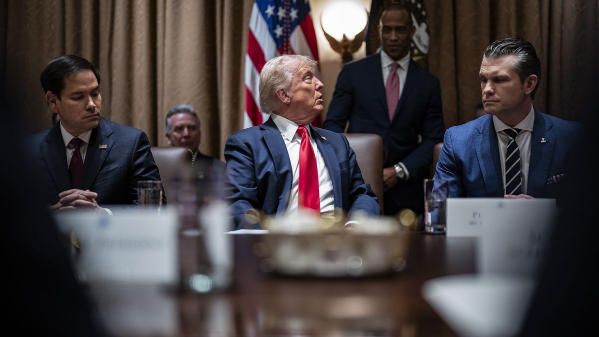 Washington, DC - February 26 : President Donald J Trump, flanked by Secretary of State Marco Rubio and Secretary of Defense Pete Hegseth, looks back at Secretary of Housing and Urban Development Scott Turner as he speaks at his first cabinet meeting of his second term at the White House on Wednesday, Feb 26, 2025 in Washington, DC. (Photo by Jabin Botsford/The Washington Post via Getty Images)