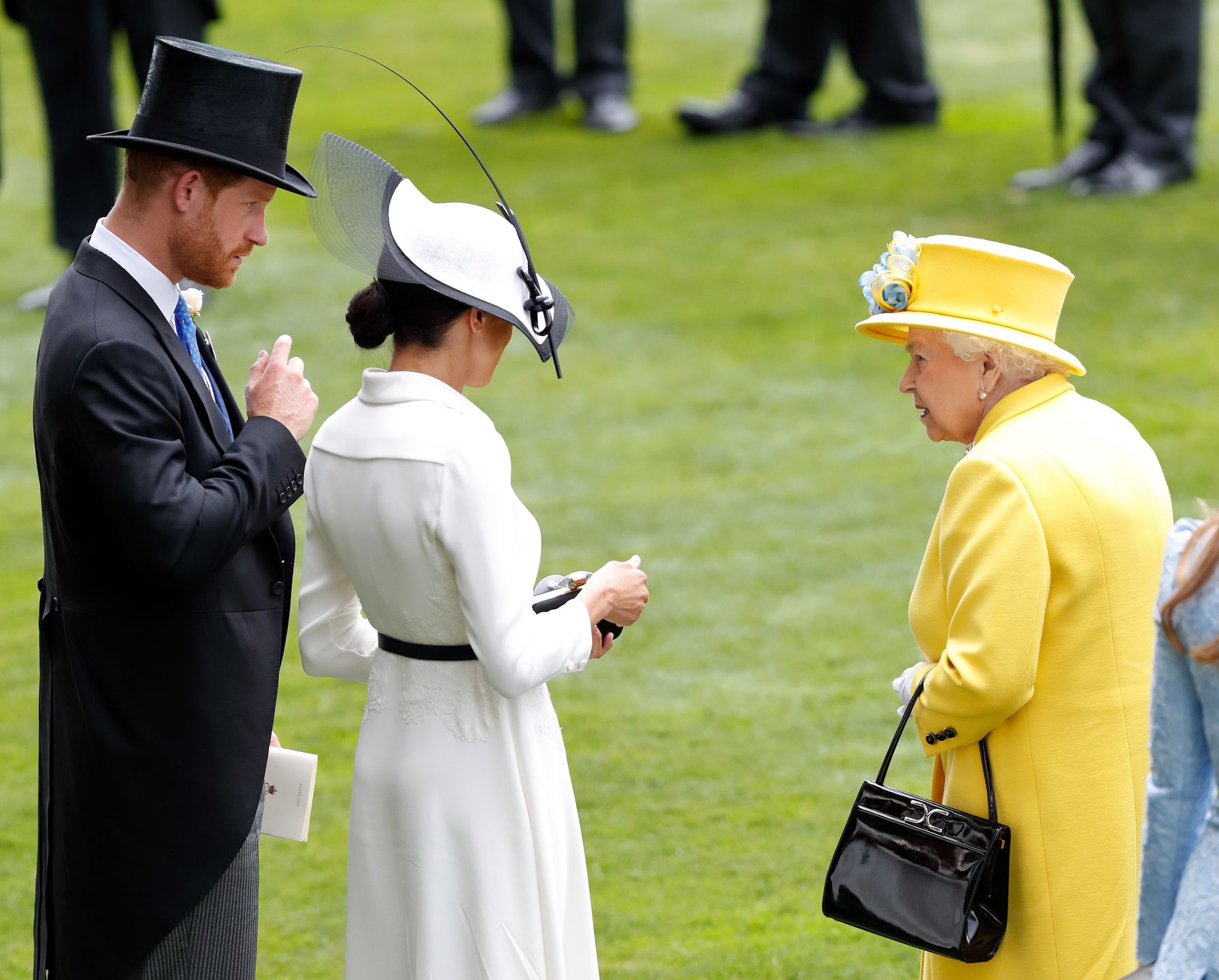 Meghan Markle, książę Harry i królowa Elżbieta II
