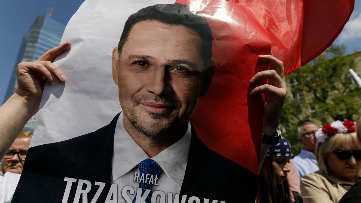 WARSAW, POLAND - 2025/05/25: Participants of the Patriots' March show support for Polish presidential candidate Rafal Trzaskowski outside the city hall. In the first round of Poland's presidential election, Warsaw Mayor Rafal Trzaskowski received 31.52% of the vote, while Karol Nawrocki garnered 29.53%. On May 25, 2025, two separate marches in support of each candidate took place in Warsaw. The second round is scheduled to take place on June 1, 2025. (Photo by Volha Shukaila/SOPA Images/LightRocket via Getty Images)