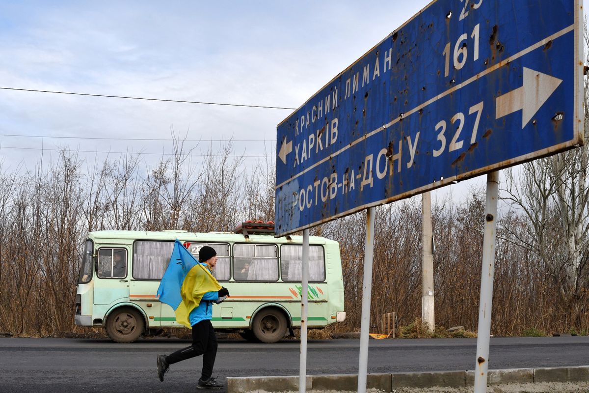 KRAMATORSK, DONETSK, UKRAINE - 2021/11/21: A runner with a flag seen in action during the patriotic marathon. 
A private Ukrainian postal and courier company Nova Poshta launched on November 7 a Marathon No One Wants to Run in New York (Donetsk region, Ukraine) less than a mile from the front line. A Marathon aims to remind the world that the war in Ukraine is still ongoing. Any runner in the world may join the Marathon and run at any time and over any distance, regardless of the location. (Photo by Andriy Andriyenko/SOPA Images/LightRocket via Getty Images)