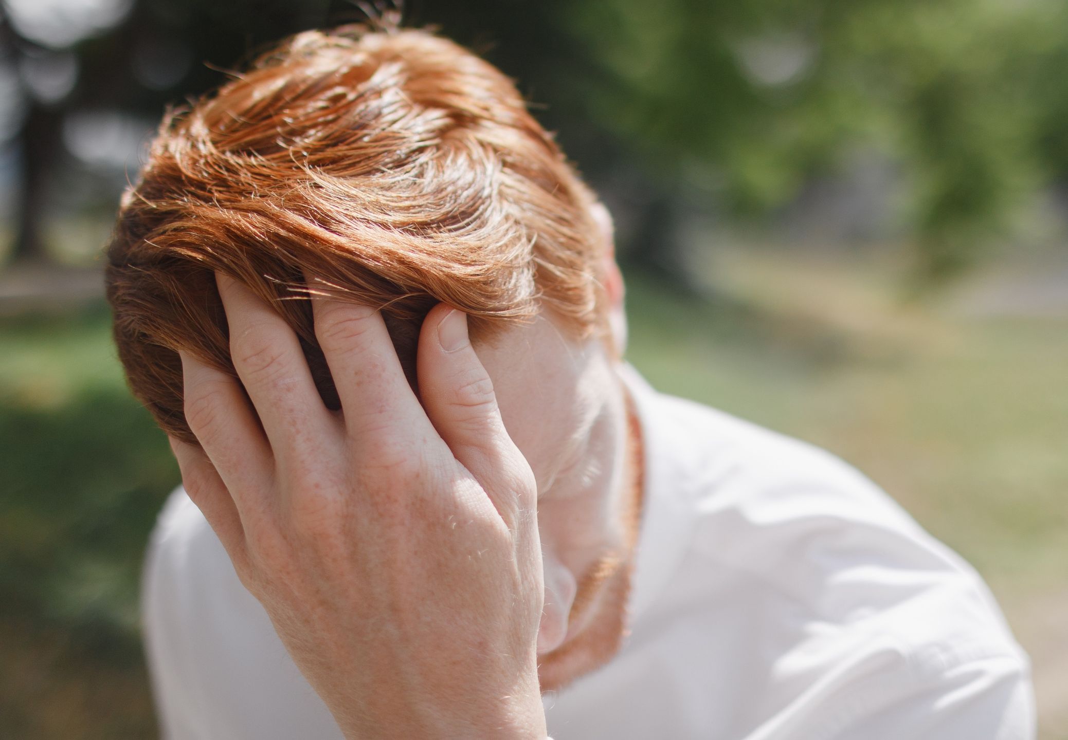Young sad redhead man in the bright sun
Handsome redhead man with stylish haircut sits in the sun. He straightens his hair and half of his face is hidden. He is dressed in the classy white shirt. Trees and sunny lawn are on the background.
Victor Dyomin