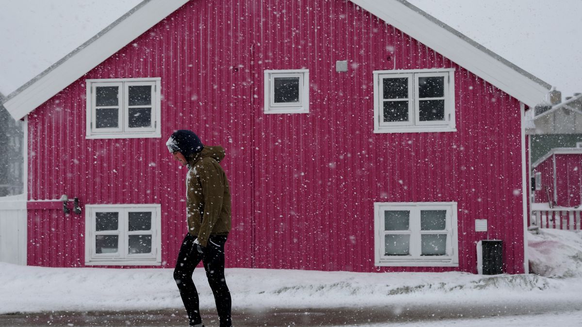 NUUK, GREENLAND - MARCH 13: A person walks in a heavy snowstorm as it blankets the area on March 13, 2025 in Nuuk, Greenland. The self-ruling Danish territory and world's largest island has been thrust into the geopolitical spotlight as U.S. President Donald Trump has vowed to acquire it, citing its strategic value, drawing objections from Danish and Greenlandic leaders. In his State of the Union address, Trump said the US needed Greenland for national security and would "get it one way or the other," but added that he supported Greenlanders' right to determine their own future. The territory holds its general election on March 11. (Photo by Joe Raedle/Getty Images)