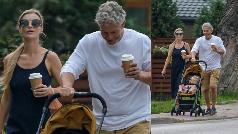 Joanna Krupa z kawą i smartfonem w ręce oprowadza męża i córeczkę po Warszawie