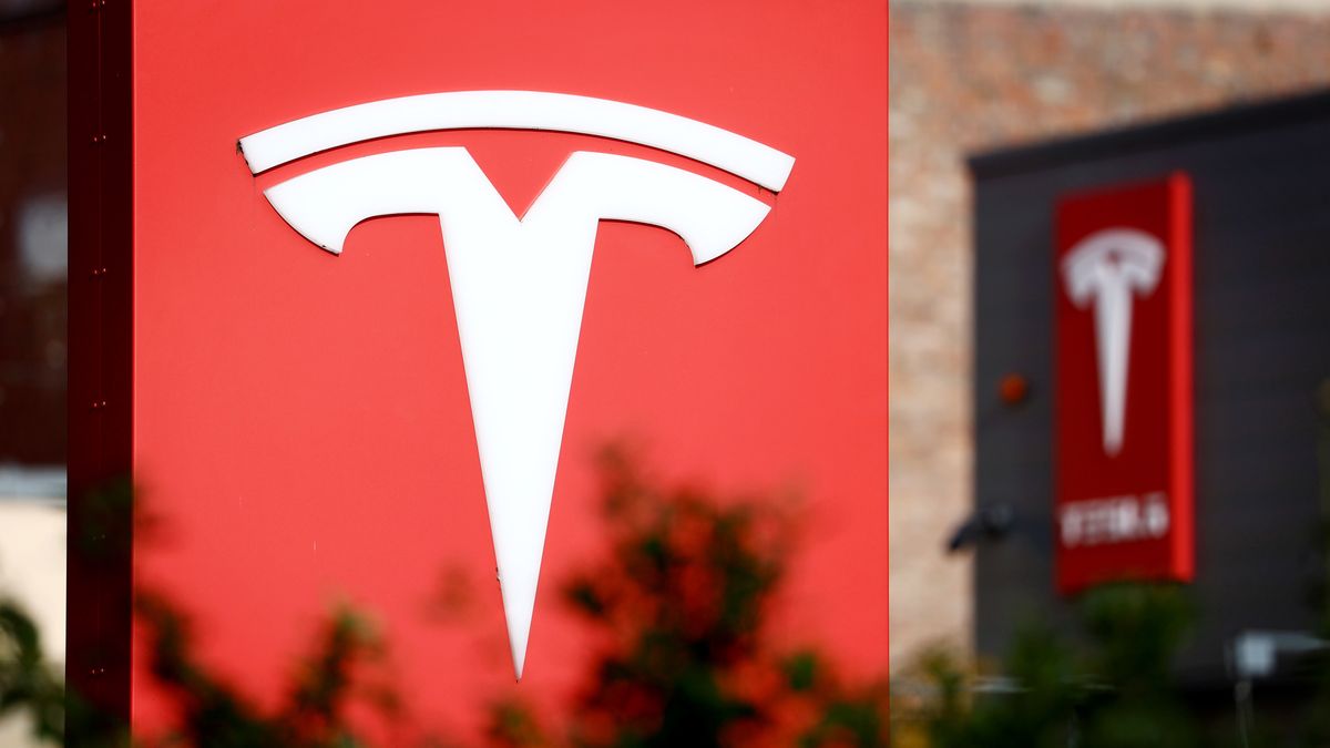 A sign at Tesla Inc. electric vehicle dealership in Berlin, Germany, on Tuesday, Nov. 7, 2023. Tesla will produce a new model that will cost 25,000 ($26,863) at its factory near Berlin, Reuters reported, as competition intensifies to produce more affordable electric vehicles for the European market. Photographer: Liesa Johannssen-Koppitz/Bloomberg via Getty Images