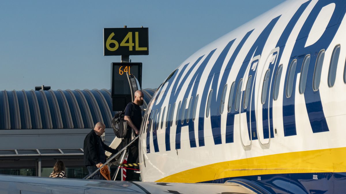 Passengers waiting in line and boarding a Ryanair low cost airline airplane at London Stansted Airport in the UK. The Boeing 737-800 passenger aircraft of the budget carrier has the registration tail number EI-ENF. Ryanair is an Irish Ultra Low-cost carrier group with headquarters in Dublin, Ireland with a fleet of 607 planes. Stansted Airport is the tertiary international airport serving London, the capital of England and the United Kingdom, fourth busiest in the UK owned by Manchester Airports Group. Stansted, United Kingdom on October 11, 2024 (Photo by Nicolas Economou/NurPhoto via Getty Images)