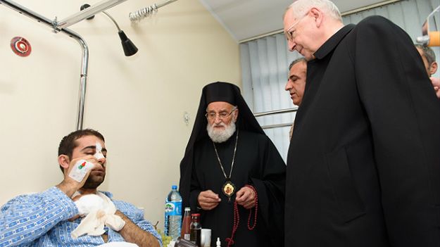 Patriarcha Syrii Grzegorz III Laham i arcybiskup Stanisław Gądecki odwiedzili pobitego Syryjczyka