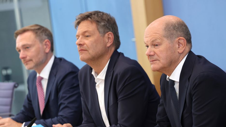 BERLIN, GERMANY - JULY 05: German Chancellor Olaf Scholz (R), Finance Minister Christian Lindner (L) and Economy and Climate Action Minister Robert Habeck speak to the media to present the coalition government's plan for the 2025 federal budget on July 05, 2024 in Berlin, Germany. Negotiations went deep into the night yesterday and today and concluded months of wrangling that many feared could have lead to the breakup of the three-party coalition government. (Photo by Sean Gallup/Getty Images)