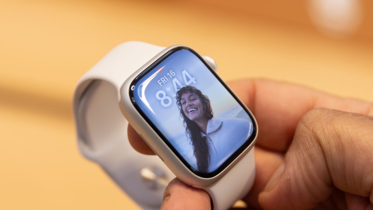 A shopper holds an Apple Watch Series 8 on sale at the company's Fifth Avenue store in New York, US, on Friday, Sept. 16, 2022. The latest iPhone hits stores Friday, and Apple Inc. is counting on well-heeled shoppers to make the device a hit during a year of roaring inflation and shaky technology spending. Photographer: Jeenah Moon/Bloomberg via Getty Images
