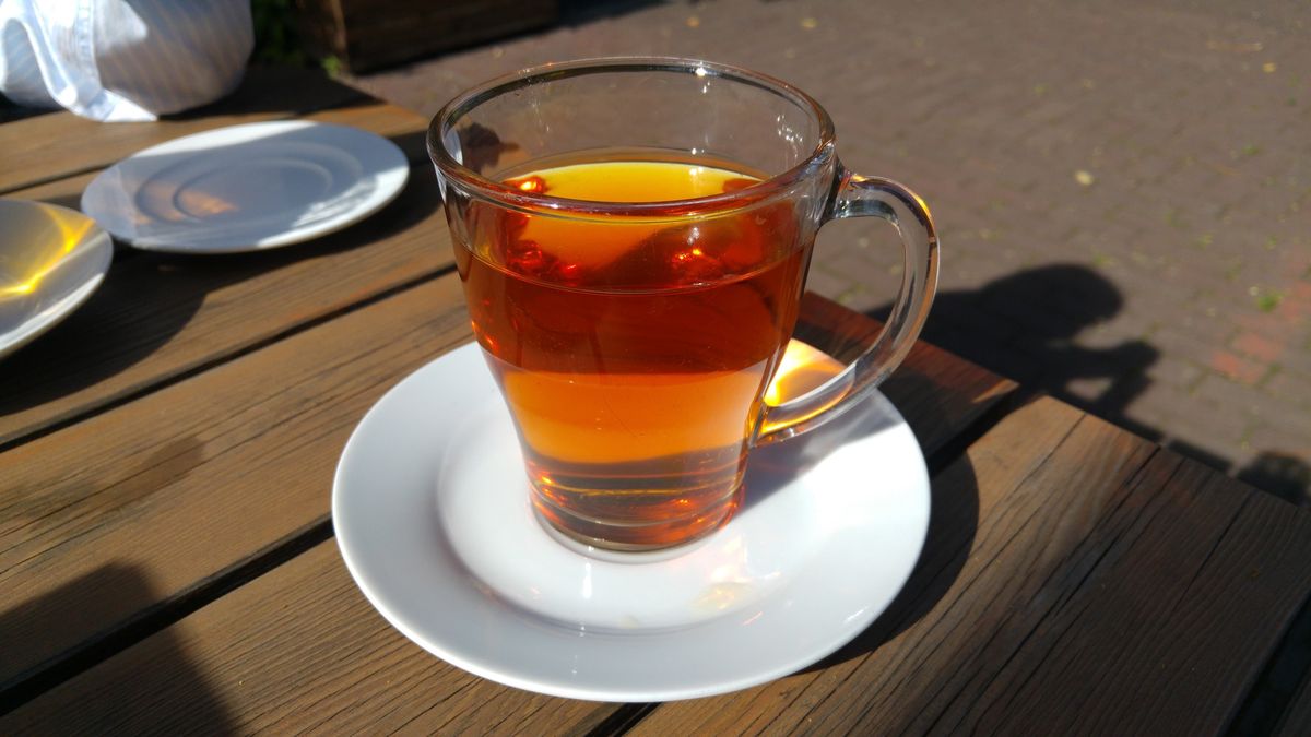 Close-Up Of Glass With Tea Served On Table At Cafe
Friedemann Kiersch / EyeEm
Drink, Wood - Material, Black Tea, High Angle View, Drinking Glass, Tray, Non-Alcoholic Beverage, Outdoor Cafe, No People, Food, Healthy Eating, Freshness, Beverage, Cup, Serving Size, Day, Glass, Food And Drink, Herbal Tea, Sunny, Close-Up, Plate, Clear, Drinking, Refreshment, Table, Saucer, Tea - Hot Drink, Tea, Horizontal Image
