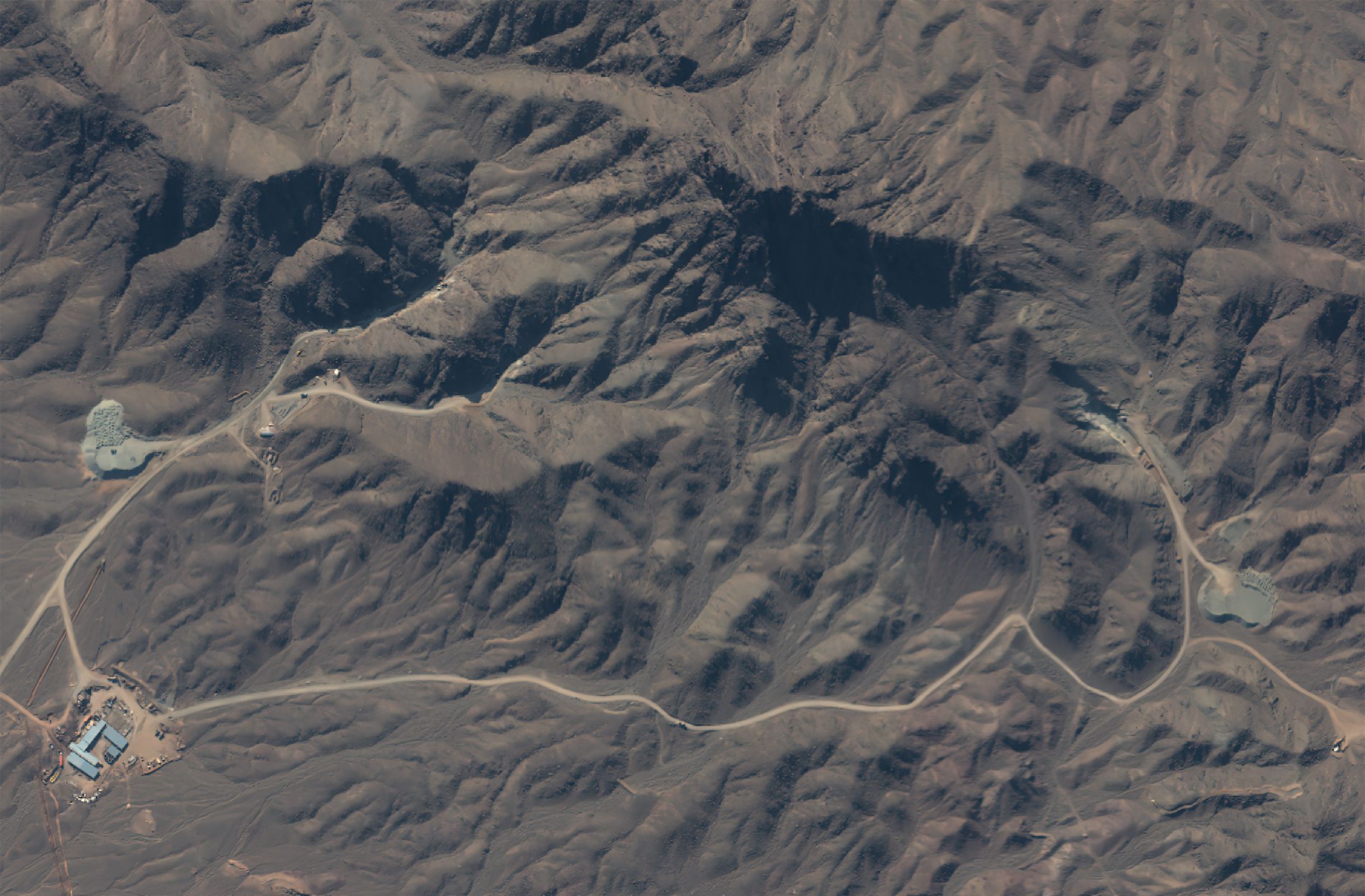 NATANZ URANIUM ENRICHMENT SITE, IRAN -- JANUARY 5, 2021:  An overview of the construction area related to the future underground centrifuge assembly facility in the mountainous area south of the Natanz uranium enrichment site.   Please use: Satellite image (c) 2019 Maxar Technologies.
