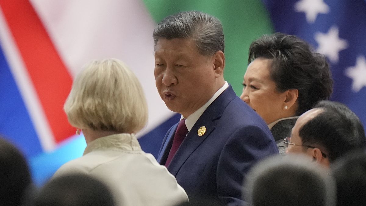 BEIJING, CHINA - OCTOBER 13: Iceland's President Halla Tomasdottir (L) interacts with China's President Xi Jinping during the opening ceremony of the Global Women's Summit 2025 at China National Convention Center on October 13, 2025 in Beijing, China. (Photo by Ken Ishii - Pool/Getty Images)