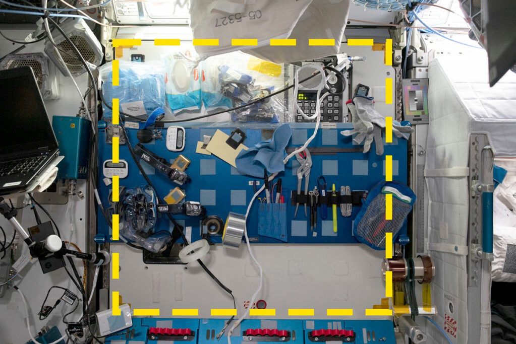 Location of the SQuARE experiment sample: square 03 located in the work area of the International Space Station. On the right side, the crew quarters can be seen. The yellow dashed line indicates the boundaries of the study area.