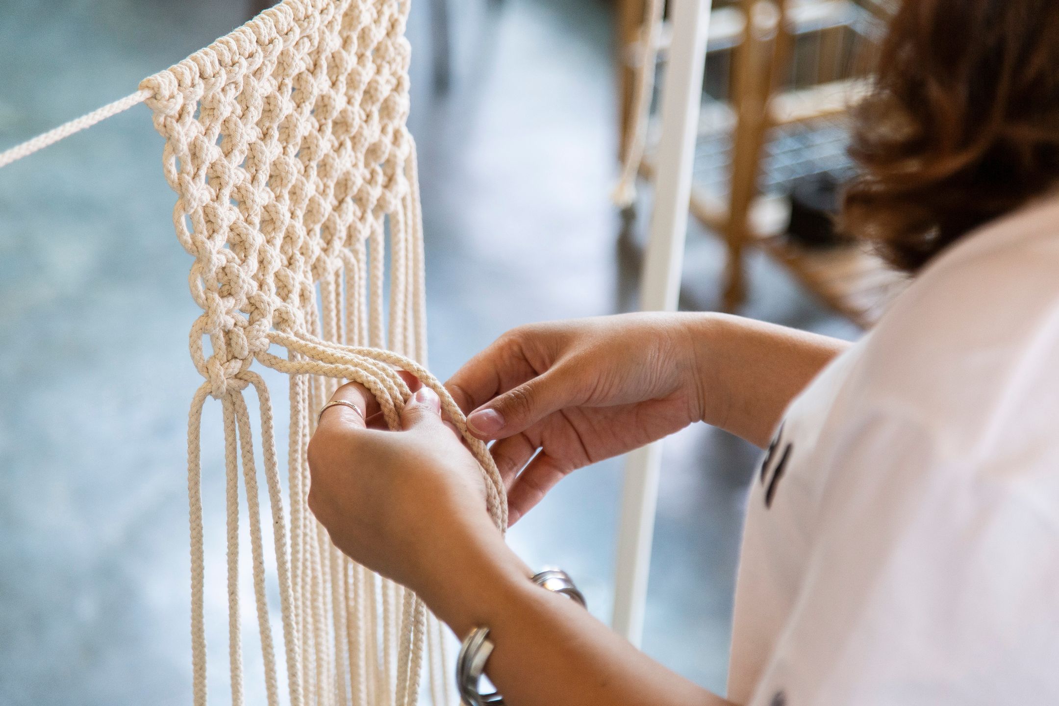object, arts, modern, hanging decoration, lace, knots, hanging, display, traditional, decor, crafts, fabric, handmade, craft, made, string, style, vintage, scandinavian, element, weaving, beautiful, eco, crochet, boho, young, rope, retail, sewing, art, thread, people, lifestyle, material, knit, weave, fashion, pattern, ornament, design, decoration, hand, macrame, texture, workshop, textile, embroidery, closeup, background, hobby