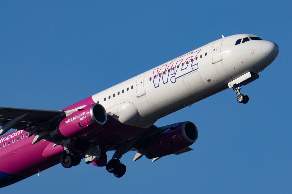 Wizz Air Airbus A321 aircraft as seen during taxiing, take off and flying phase departing from Eindhoven airport EIN during a blue sky sunny winter day.  W!ZZ Air is a Hungarian Ultra Low Cost Airline Carrier with the largest bases at Budapest Airport and Luton Airport flying to 164 airports. The A321-200 plane with the logo inscription on the side has the registration HA-LXV. The world aviation industry is trying to recover from the negative impact of the Covid-19 Coronavirus pandemic. Eindhoven, The Netherlands on November 22, 2021 (Photo by Nicolas Economou/NurPhoto via Getty Images)