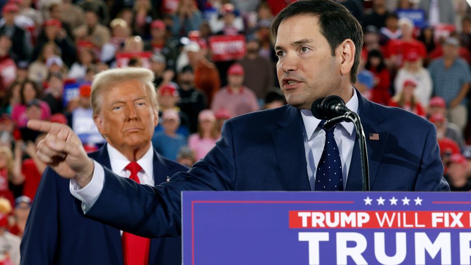 RALEIGH, NORTH CAROLINA - NOVEMBER 04:  Republican presidential nominee, former U.S. President Donald Trump watches as U.S. Sen. Marco Rubio (R-FL) speaks during a campaign rally at the J.S. Dorton Arena on November 04, 2024 in Raleigh, North Carolina. With one day left before the general election, Trump is campaigning for re-election in the battleground states of North Carolina, Pennsylvania and Michigan.  (Photo by Chip Somodevilla/Getty Images)