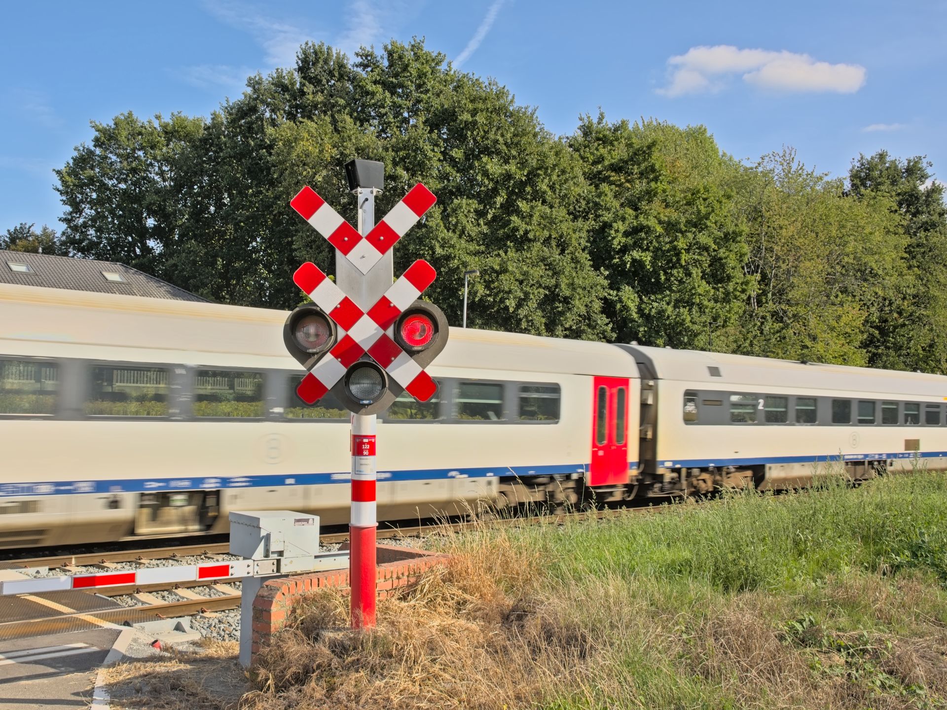 train, crossing, light, red, driving, blur, blurry, countryside, danger, flemish, level, lights, motion, movement, passenger, passing, signaling, speed, stoplight, transport, transportation, travel, warning, signaling light, movement blur