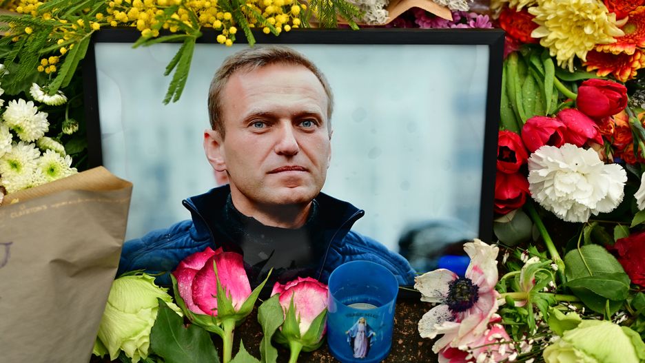 PARIS, FRANCE - FEBRUARY 19: Flowers are seen laid in homage to Alexei Navalny, next to the Russian Embassy on February 19, 2024 in Paris, France. People lay flowers and light candles for Alexei Navalny, Russia's leading opposition figure who was imprisoned by Russian authorities, and reportedly died in prison on February 16. (Photo by Christian Liewig - Corbis/Getty Images)