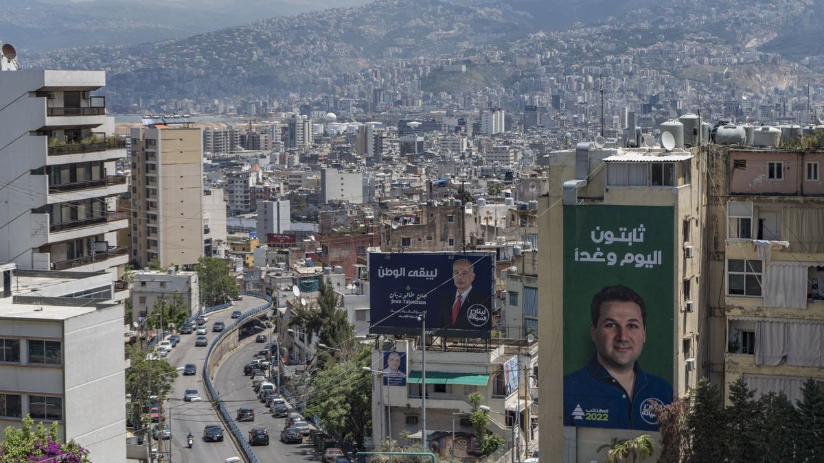 Billboard posters featuring the Lebanese Forces party candidate, Jean Talouzian, center, and the Kataeb Party candidate, Nadim Bashir Gemayel, right, on the city skyline in Beirut, Lebanon, on Saturday, May 7, 2022. Top Lebanese officials conceded theyve made little headway in meeting the conditions set as part of a preliminary agreement with the International Monetary Fund, as they made a rare outreach to bondholders more than two years after the governments debt default. Photographer: Francesca Volpi/Bloomberg via Getty Images