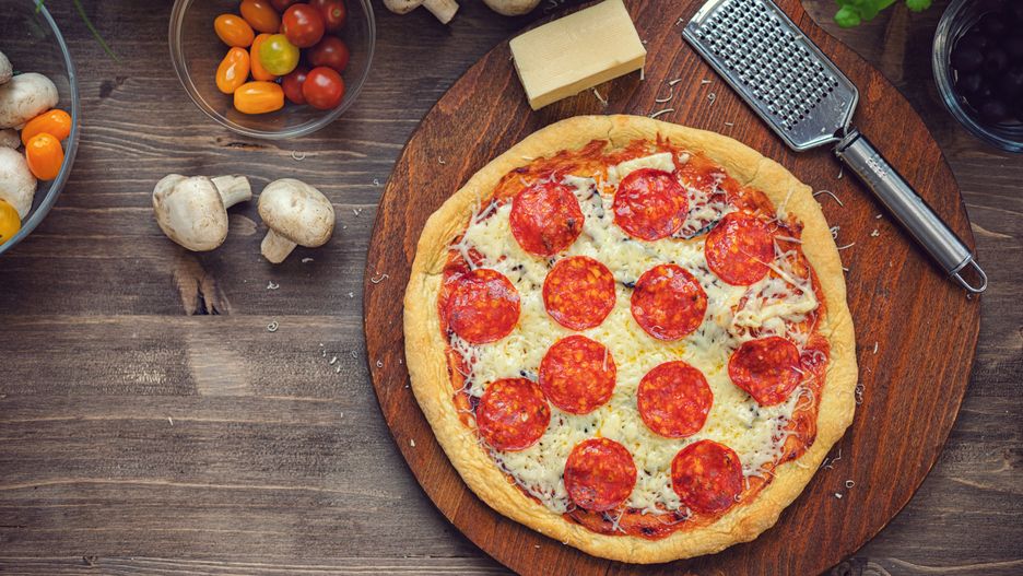 Freshly baked homemade pepperoni pizza with melted mozzarella