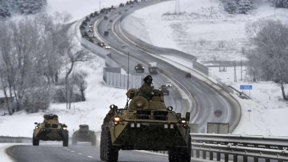 arch49A convoy of Russian armored vehicles moves along a highway in Crimea, Tuesday, Jan. 18, 2022. Russia has concentrated an estimated 100,000 troops with tanks and other heavy weapons near Ukraine in what the West fears could be a prelude to an invasion. (AP Photo)AP