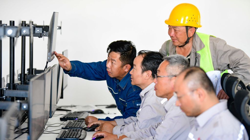 Photovoltaic Power Plant Appears In Coal Mining Subsidence Area
ERDOS, CHINA - JULY 8, 2021 - Workers adjust equipment in the main control room of the 500,000-kilowatt-day photovoltaic power generation demonstration project for ecological treatment of coal mining subsidence area in Yijin Horuo Banner, in Ordos City, Inner Mongolia, China, July 8, 2021. By July 8, 2021, the main project of the 500,000-kilowatt Tianjiao Lveng Solar Power Demonstration Project for Ecological Governance of Coal Mining Subsidence Area in Yijin Horuo Banner has been completed, and the project construction has entered the final stage. It is expected to be connected to the grid within this year. The project is located in the coal mining subsidence area of Batuta, Wulan Mulun Town, Ejingholuo Banner, Ordos City, Inner Mongolia Autonomous Region, covering an area of about 42,000 mu, with a total investment of 2.14 billion yuan. It is expected to generate 900 million KWH of electricity annually, save 341,000 tons of standard coal and reduce 841,000 tons of carbon dioxide. (Photo credit should read Costfoto/Future Publishing via Getty Images)
CFOTO