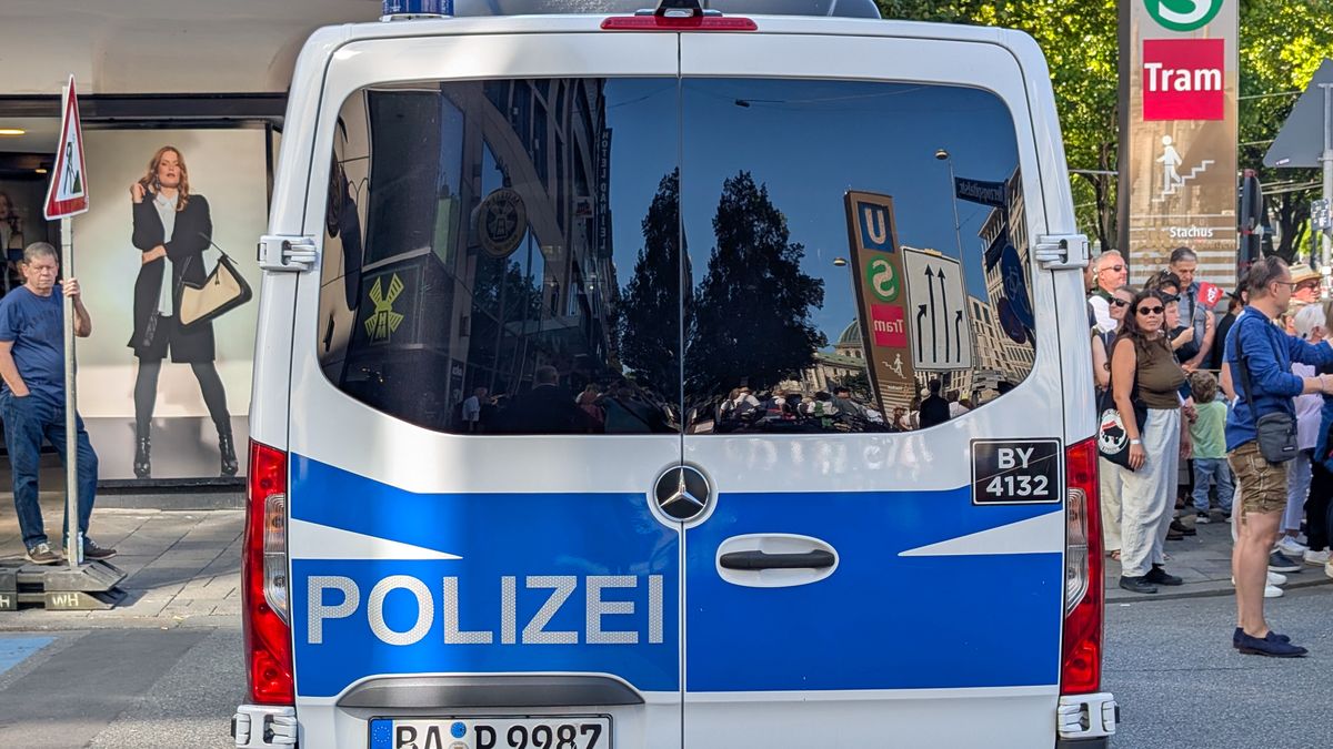 A German police van with the word ''Polizei'' on the back is parked in the city center in Munich, Bavaria, Germany, on September 21, 2025. Reflections of the surrounding buildings are visible in the van's rear windows. (Photo by Michael Nguyen/NurPhoto via Getty Images)