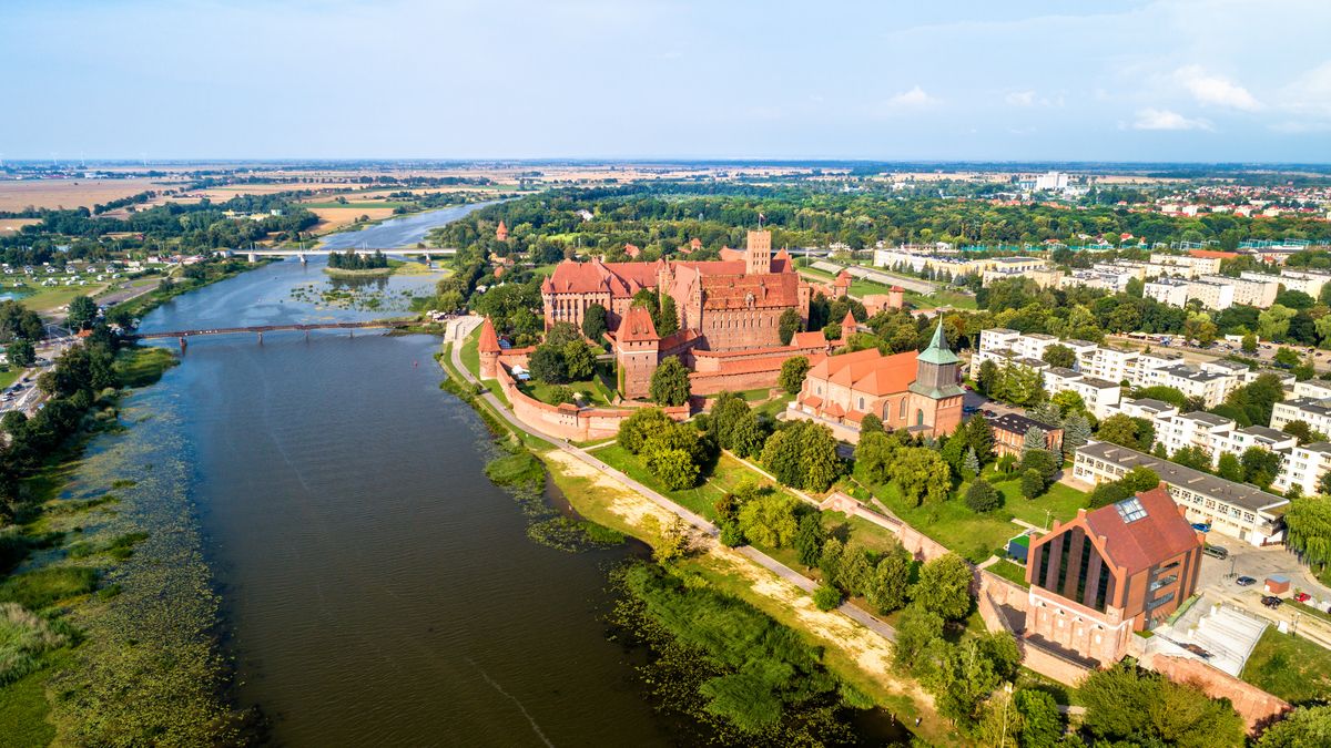 Malbork Castle on the bank of the Nogat River. UNESCO world heritage in Poland
The Castle of the Teutonic Order in Malbork on the bank of the Nogat River. UNESCO world heritage in Poland
malbork, castle, poland, aerial, architecture, building, europe, exterior, fort, medieval, old, tourism, travel, view, landmark, wall, brick, heritage, river, fortress, marienburg, gothic, fortified, historic, polish, red, teutonic, bridge, destination, european, high, order, pomerania, unesco, sky, summer, world, tower, ancient, bird, defense, nogat, scenic, green, knight, sightseeing, zulawy, town, angle, history, malbork, castle, poland, aerial, architecture, building, europe, exterior, fort, medieval, old, tourism, travel, view, landmark, wall, brick, heritage, river, fortress, marienburg, gothic, fortified, historic, polish, red, teutonic, bridge, destination, european, high, order, pomerania, unesco, sky, summer, world, tower, ancient, bird, defense, nogat, scenic, green, knight, sightseeing, zulawy, town, angle, history