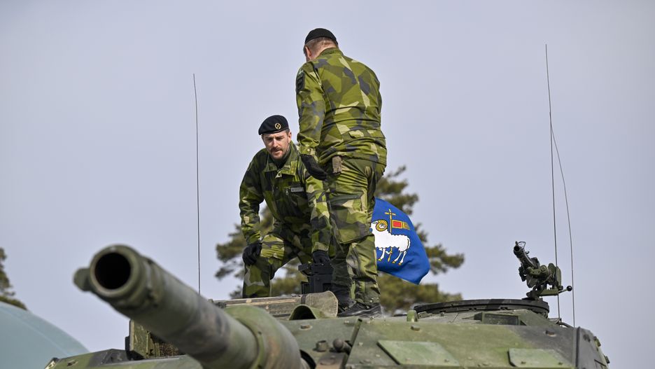 Soldiers on a Stridsvagn 122 battle tank at the base of the Swedish Army's Gotland Regiment near Visby, Sweden, on Friday, March 25, 2022. Sweden's armed forces are boosting preparedness in regions including the Baltic island of Gotland, citing Russias increased military activity in the area. Photographer: Mikael Sjoberg/Bloomberg via Getty Images