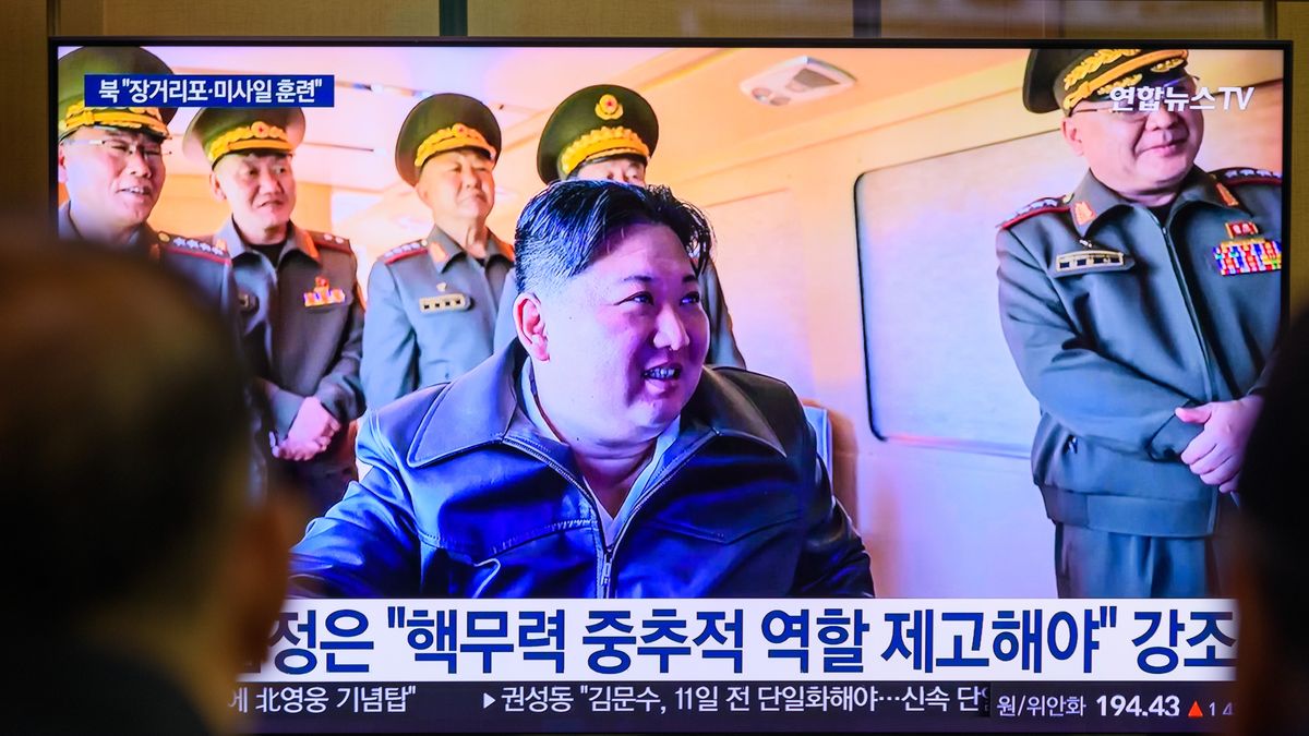 SEOUL, SOUTH KOREA - 2025/05/09: People watch a 24-hour Yonhap News TV broadcast on a large screen at Seoul Railway Station, showing North Korean leader Kim Jong Un inspecting a joint striking drill involving long-range artillery and missile systems of the Korean People's Army eastern front division, at an undisclosed location in North Korea. North Korean leader Kim Jong Un oversaw a joint striking drill involving long-range artillery and a new variant of tactical ballistic missiles, reaffirming the combat readiness of the country's nuclear forces, state media KCNA reported on May 9. The exercise featured a 600mm multiple rocket launcher and the Hwasongpho-11-Ka tactical ballistic missile. South Korea's military detected multiple short-range ballistic missile launches from Wonsan between 8:10 and 9:20 a.m. on May 8North Korea's fourth missile test of the year. (Photo by Kim Jae-Hwan/SOPA Images/LightRocket via Getty Images)