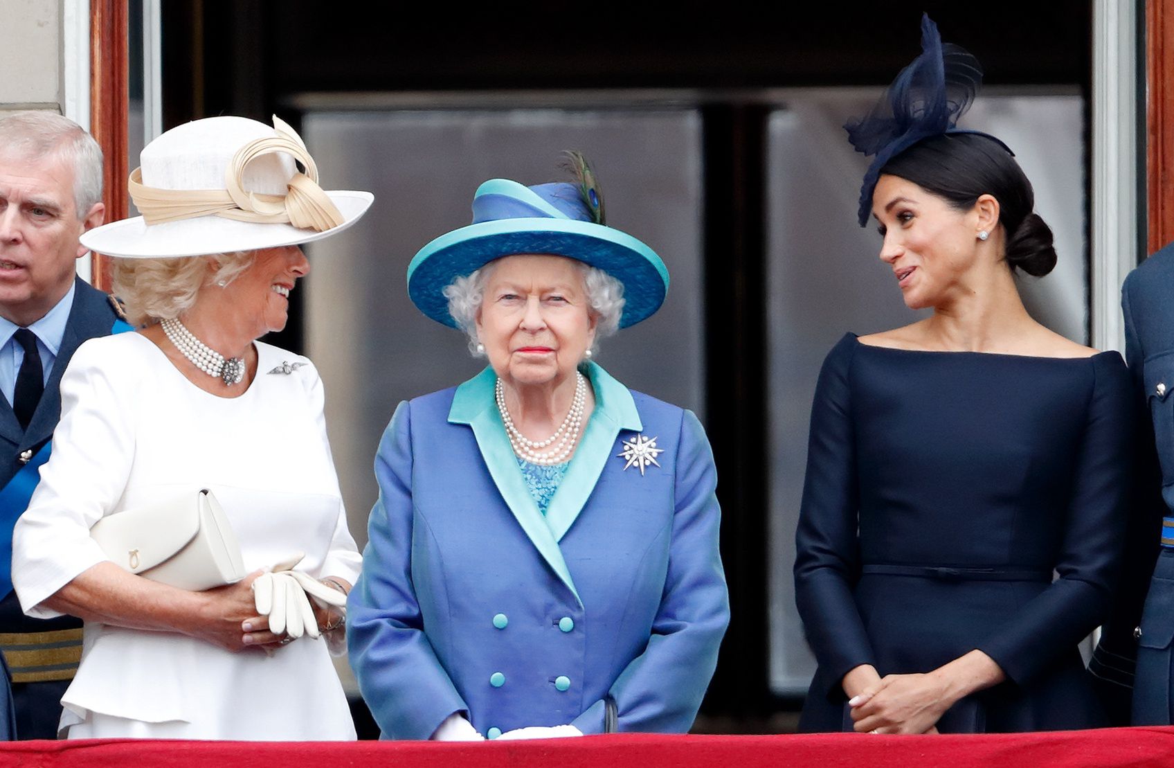 Members Of The Royal Family Attend Events To Mark The Centenary Of The RAFLONDON, UNITED KINGDOM - JULY 10: (EMBARGOED FOR PUBLICATION IN UK NEWSPAPERS UNTIL 24 HOURS AFTER CREATE DATE AND TIME) Camilla, Duchess of Cornwall, Queen Elizabeth II and Meghan, Duchess of Sussex watch a flypast to mark the centenary of the Royal Air Force from the balcony of Buckingham Palace on July 10, 2018 in London, England. The 100th birthday of the RAF, which was founded on on 1 April 1918, was marked with a centenary parade with the presentation of a new Queen's Colour and flypast of 100 aircraft over Buckingham Palace. (Photo by Max Mumby/Indigo/Getty Images)Max Mumby/Indigo