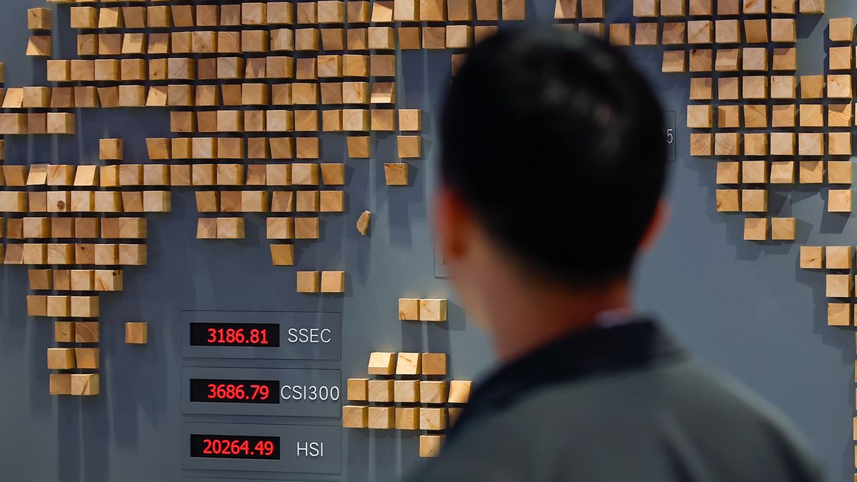 TAIPEI, TAIWAN - APRIL 10: A man looks at digital boards show surging stock shares at the Taiwan Stock Exchange office, following U.S. President Donald Trump's surprise decision to pause the global tariffs, in Taipei, Taiwan, on April 10, 2025. Stock markets in the Asia-Pacific and Europe such as Taiwan, Japan, South Korea, Singapore, Hong Kong, China, and India have seen surges in shares following Washington's decision to halt the implementation of global high tariffs for 90 days The indexes showing signs of rebound include NIKKEI, KOSPI, HSI, TAIEX, DAX, DJIA and so on. However, tariffs on China remain unchanged. (Photo by Daniel Ceng/Anadolu via Getty Images)