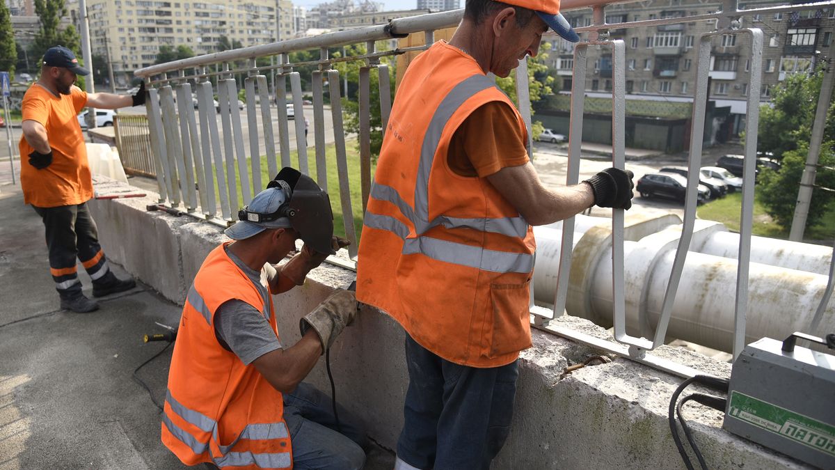 KYIV, UKRAINE - JUNE 20, 2024 - Workers repair part of the pedestrian section of the Povitroflotskyi Overpass which collapsed onto tram tracks on Wednesday, June 19, in Kyiv.  (Photo credit should read Kaniuka Ruslan / Ukrinform/Future Publishing via Getty Images)
