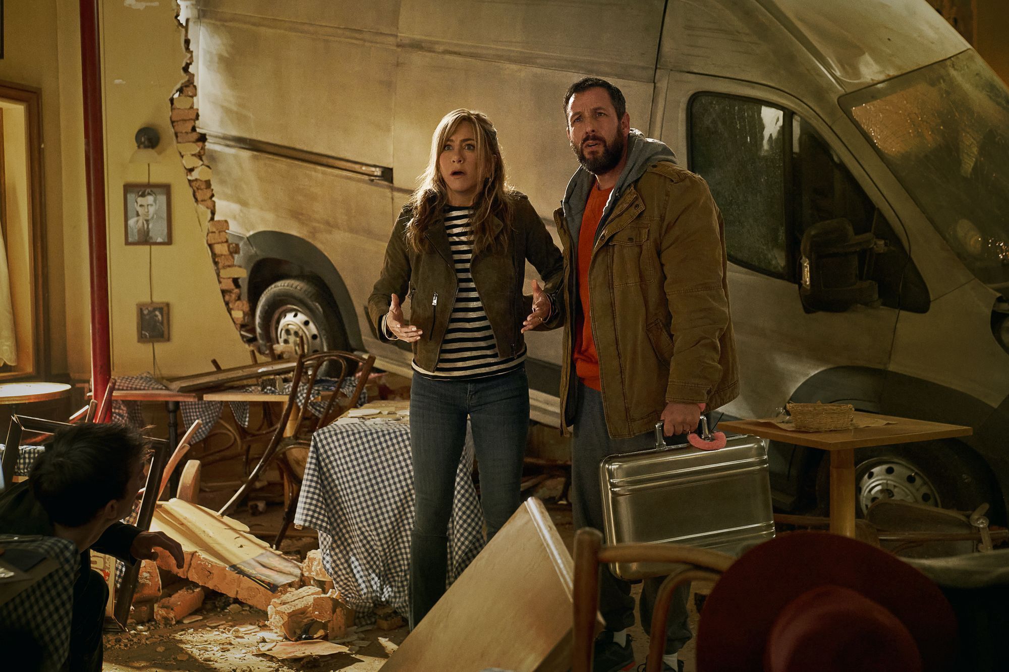 Murder Mystery 2Murder Mystery 2. (L-R) Jennifer Aniston as Audrey Spitz and Adam Sandler as Nick Spitz in Murder Mystery 2. Cr. Scott Yamano/Netflix © 2023.