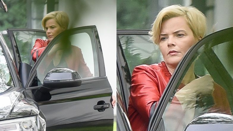 Monika Zamachowska otwiera drzwi do samochodu Konradowi Wojterskowskiemu